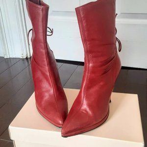 Red leather Made in Italy heeled boots.